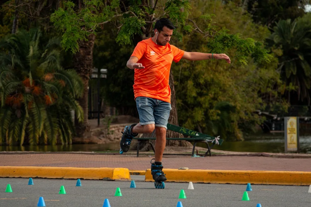man performing balance exercise in park